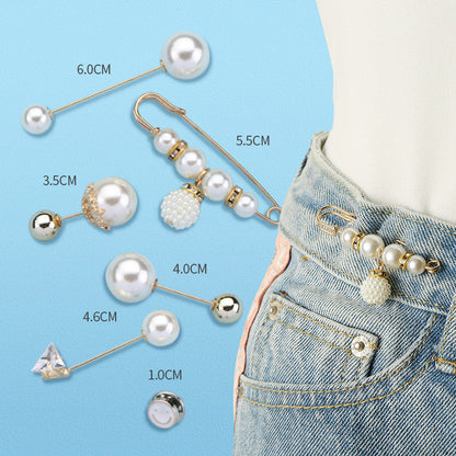 Set met spelden om de taille van een broek strakker te maken zonder te naaien
