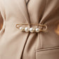 Set met spelden om de taille van een broek strakker te maken zonder te naaien