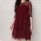 Elegante jurk met hoge en lage zoom en kanten overlay voor dames