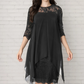 Elegante jurk met hoge en lage zoom en kanten overlay voor dames