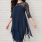 Elegante jurk met hoge en lage zoom en kanten overlay voor dames