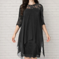 Elegante jurk met hoge en lage zoom en kanten overlay voor dames